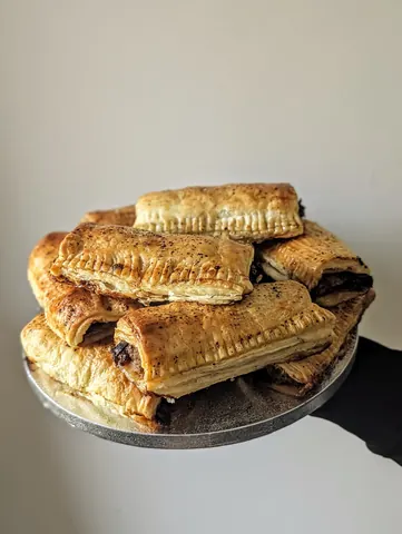 A plate with a bunch of pastries on it.