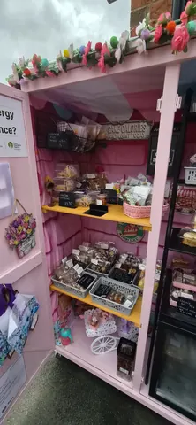 A pink shelf with a sign that says "energy" on it.