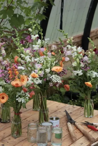 A table with a vase of flowers on it.