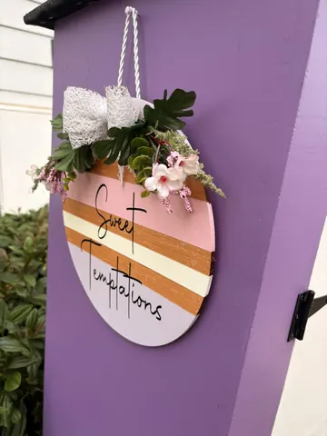 A purple wall with a sign that says "French Toast".
