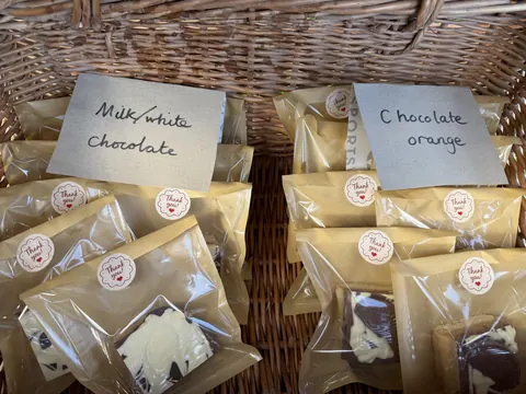 A basket of chocolate and orange cookies.