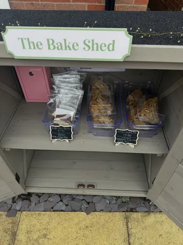 A sign that says "The Bakery Shed" is on a building.