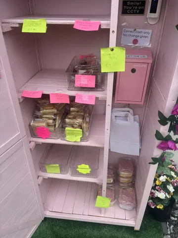 A pink cabinet with a sign that says "convenient cash only" on it.