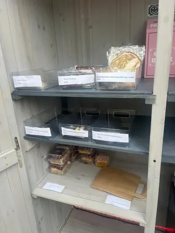 A shelf with a sign that says "Banana bread" on it.