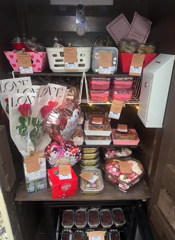 A refrigerator filled with food and flowers.