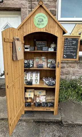 A wooden display case with a sign that says "Bakery" on it.