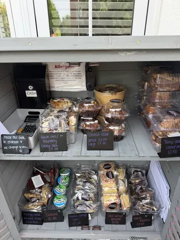 A display case filled with various food items.