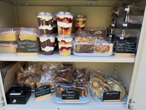 A display case filled with various desserts.