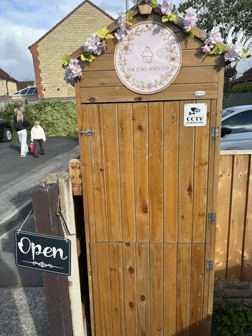 A wooden door with a sign that says "open" on it.