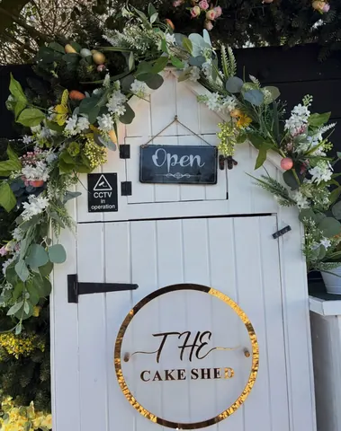 A white door with a black sign that says "open" on it.