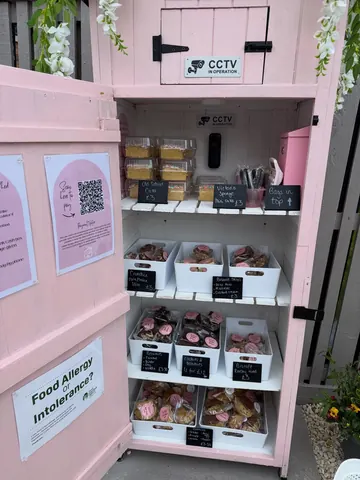 A pink box with a sign that says "Food Allergy?" on it.