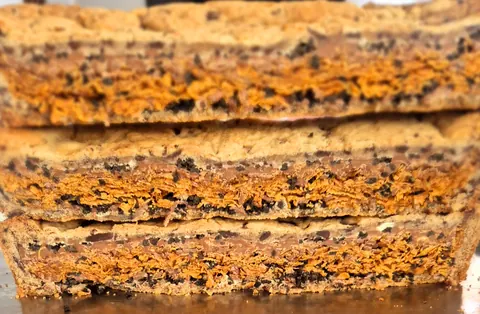 A stack of brown and orange cookies.