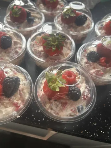 A bowl of strawberries and cream.