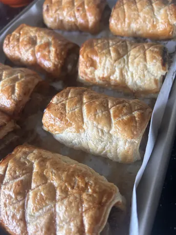 A tray of pastries is on a table.