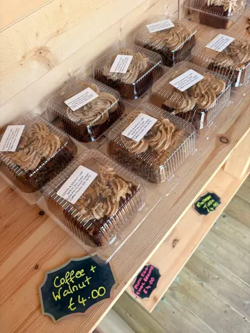 A table with a sign that says coffee w/ walnut.