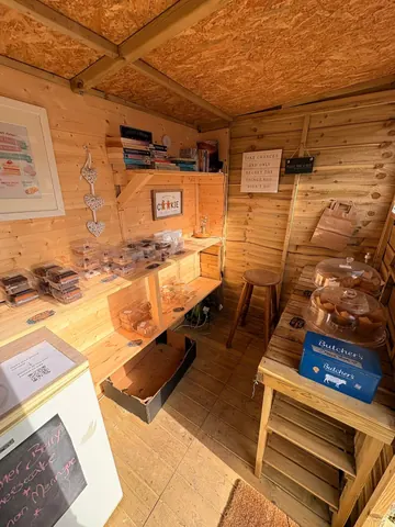 A small wooden building with a sign that says "Bakery" on it.