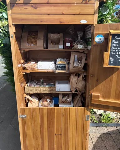 A wooden box with a sign on it.