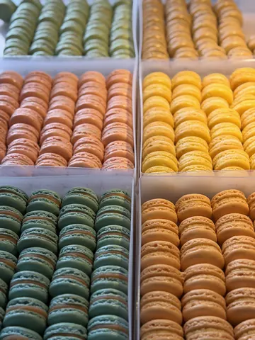 A display of various colored macaroons.
