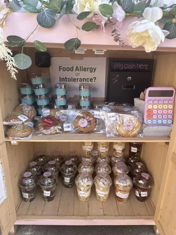 A wooden shelf with a sign that says "Food Allergy Intolerance?"
