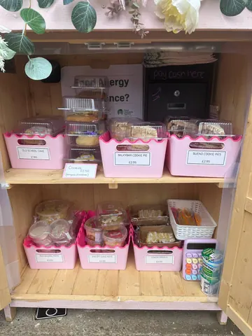 A display of food in a pink container.