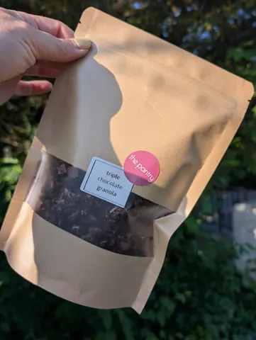A brown bag with a white label on it.