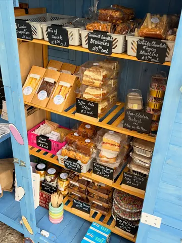A blue cabinet with a sign that says "bakery" on it.