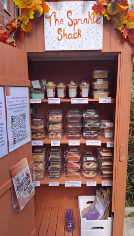 A wooden cabinet with a sign on it that says "Please do not eat the food".