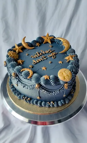 A blue cake with stars and a moon on it.