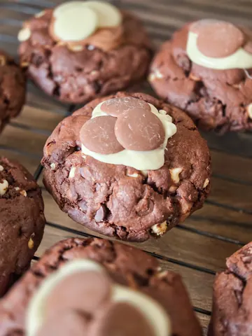 A tray of brownies with white frosting.