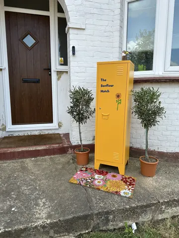 A yellow box with a flower on it.