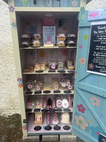 A display case with a variety of pastries and desserts.