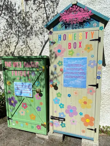 Two colorful doors with flowers painted on them.