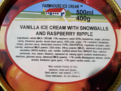A vanilla ice cream with snowballs and raspberry ripple.
