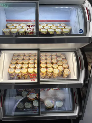 A refrigerator with a lot of food in it.