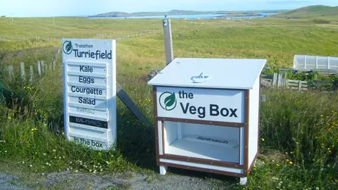 A white box with the words "The Veg Box" written on it.