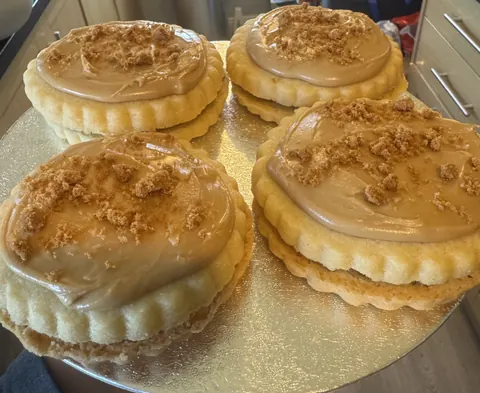 A plate with four pastries on it.