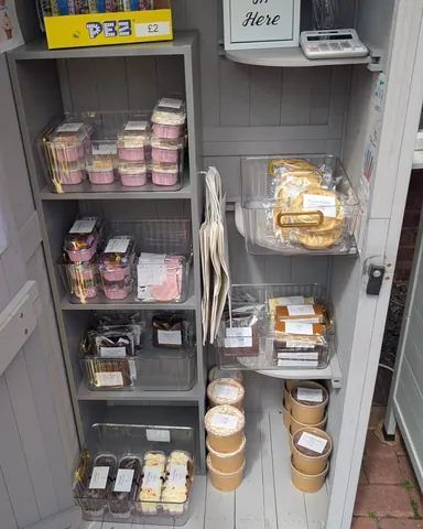 A refrigerator with a variety of food items inside.