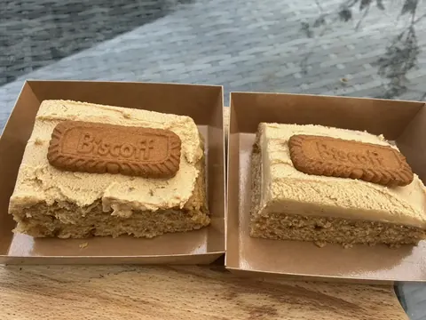 Two biscuit sandwiches with cream filling.