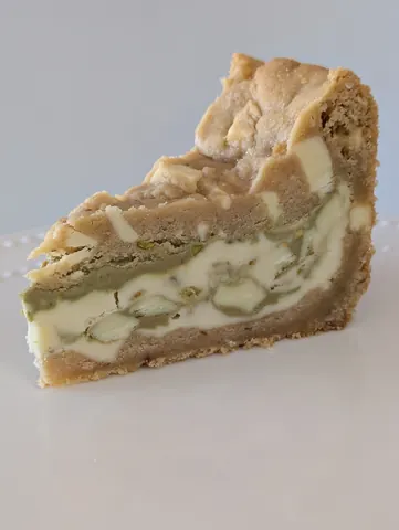 A slice of pie with a crumbly crust.