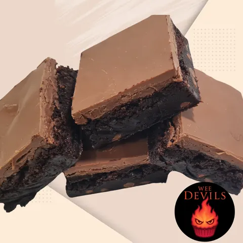A close up of a chocolate dessert with a fire emblem on it.