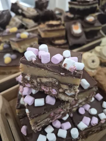 A cake with marshmallows on top.