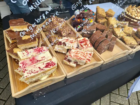 A table with a variety of desserts on it.