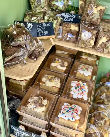 A display of various desserts in a case.